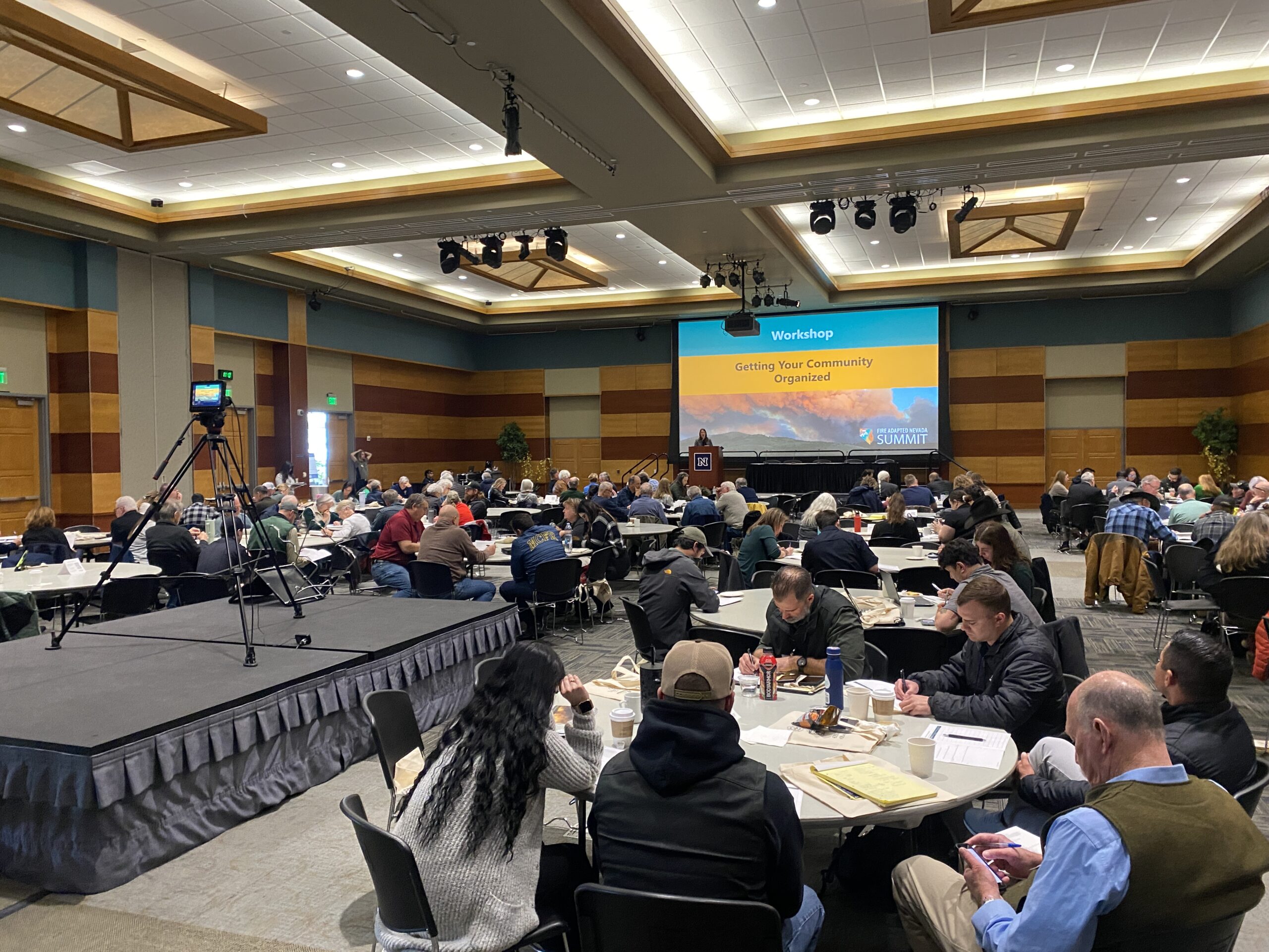 View of a large ballroom full of people in a conference setting