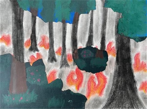 Two drawings on top of each other, one of a green forest and one with the forest on fire